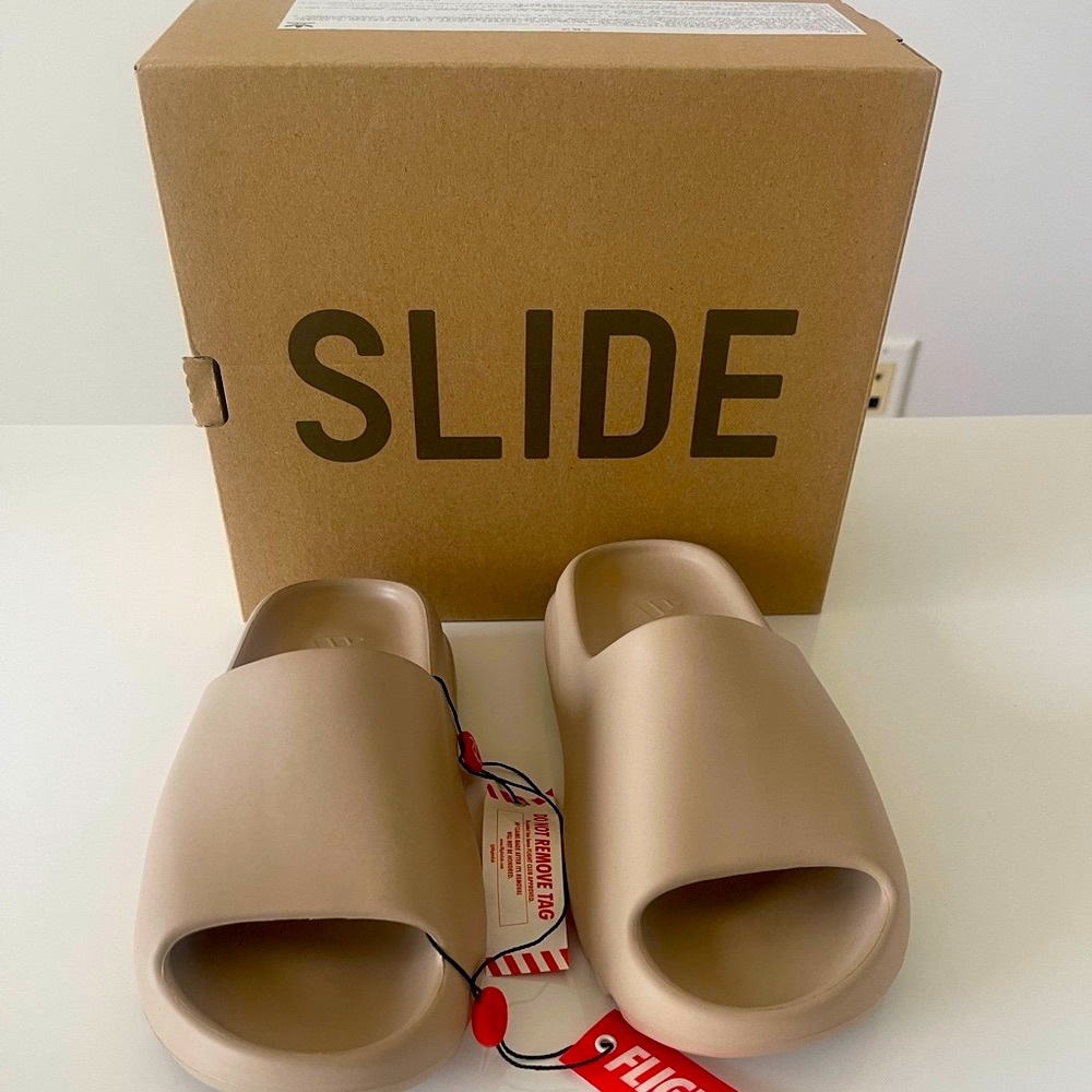Yeezy slides. First edition. Color is Pure. Men’s size 5. Women’s size 6.